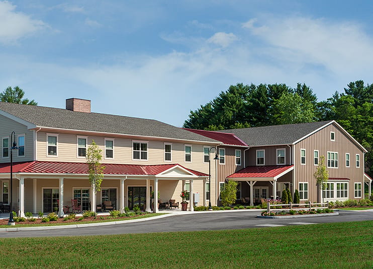 Exterior view of the facility with landscaped grounds