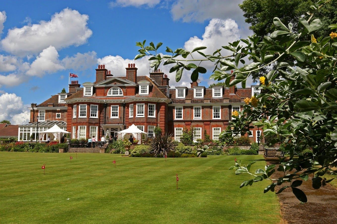 Exterior view of Castle Village surrounded by gardens
