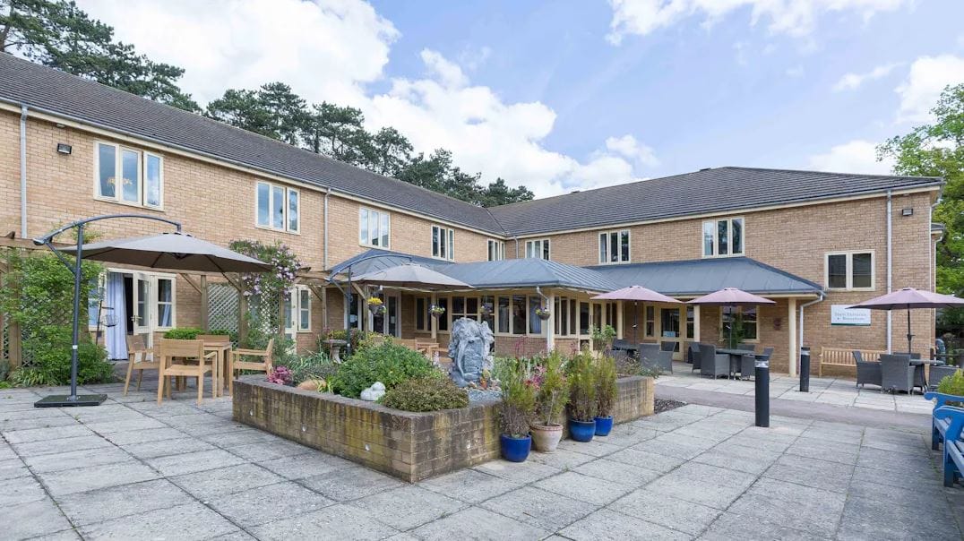 Outdoor area with seating and landscaping at the care home