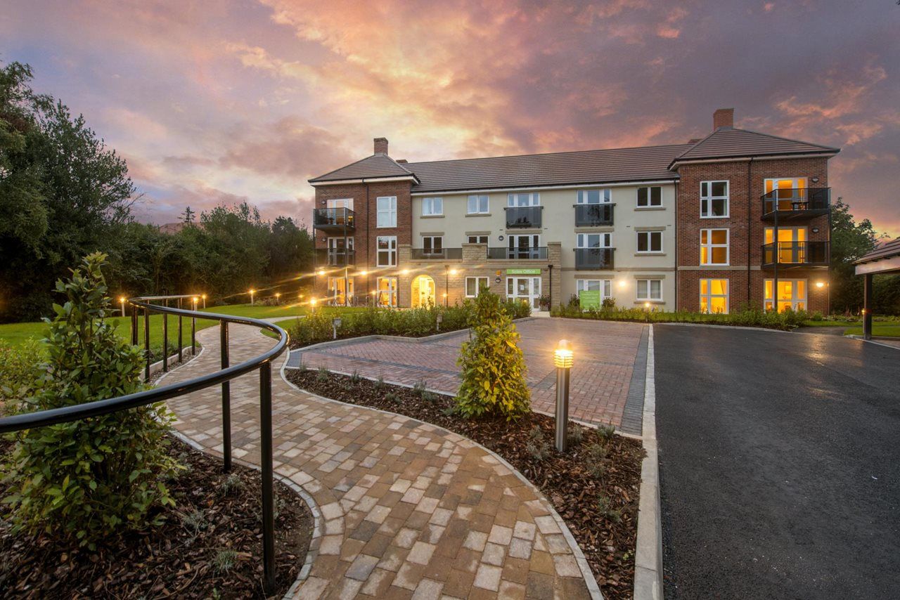 Exterior view of Chestnut Court facility at sunset