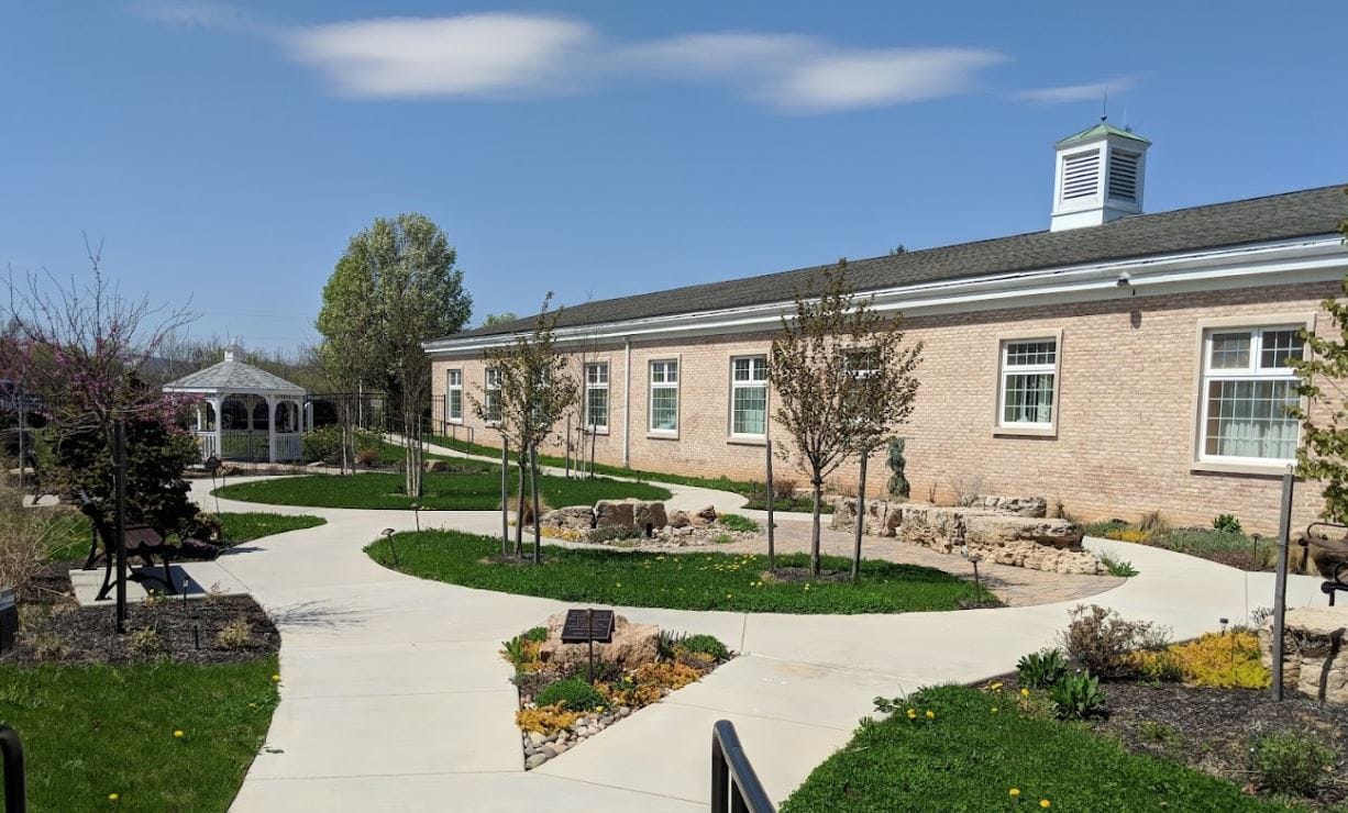 Exterior view of the facility's garden and walking path