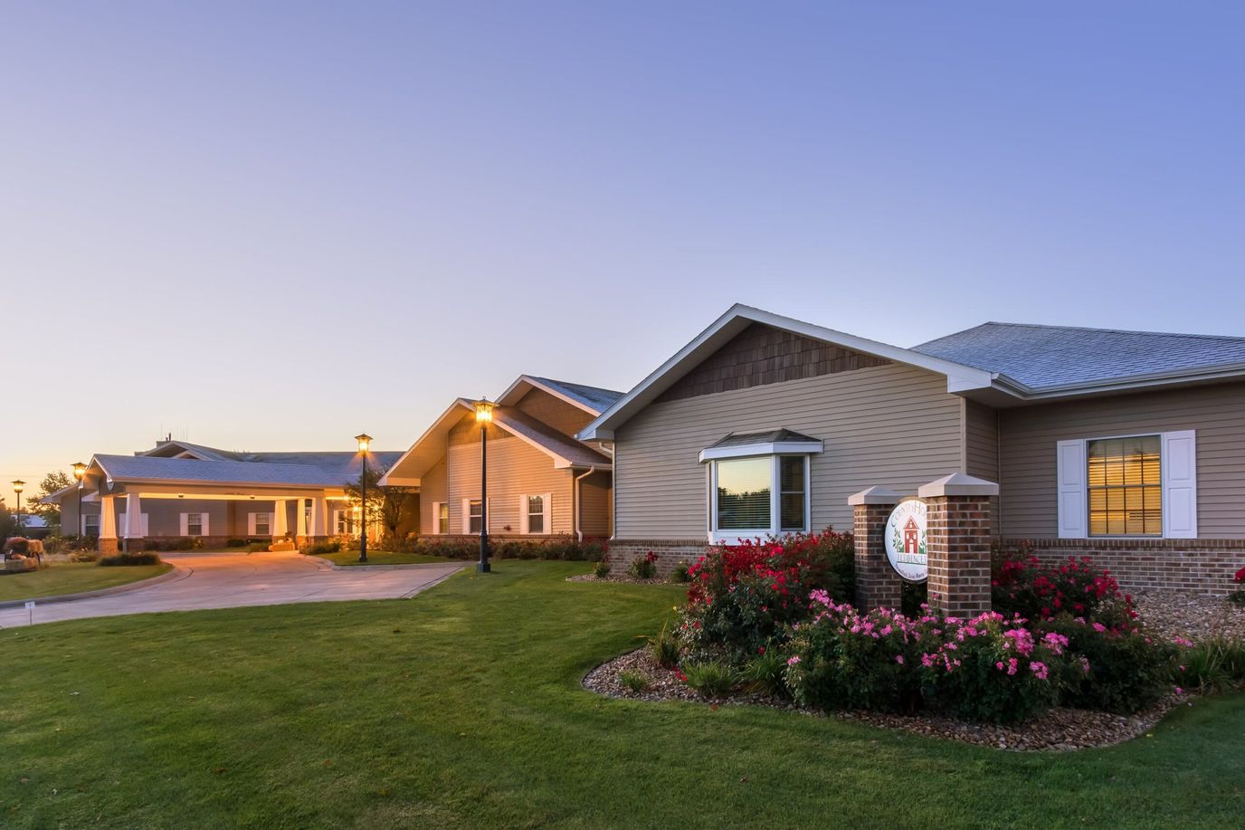 Exterior view of Country House at Grand Island during sunset