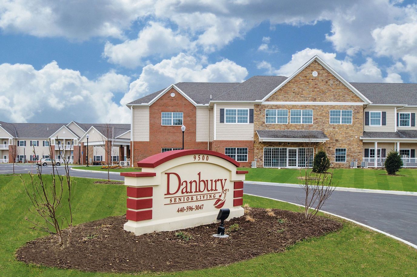 Exterior view of Danbury Senior Living facility with signage