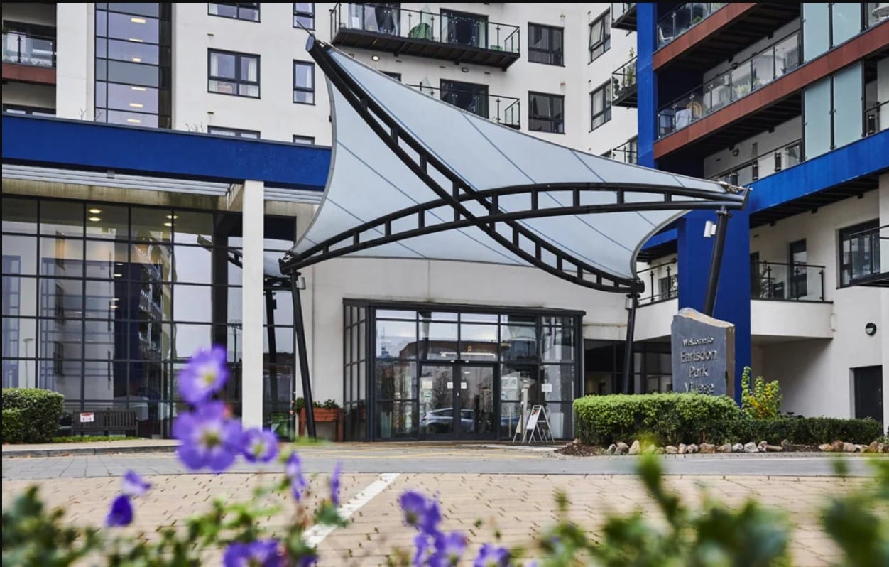 Entrance of Earlsdon Park Retirement Village with outdoor flowers
