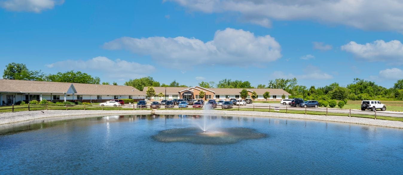 Exterior view of the Elizabeth Scott Community with a pond