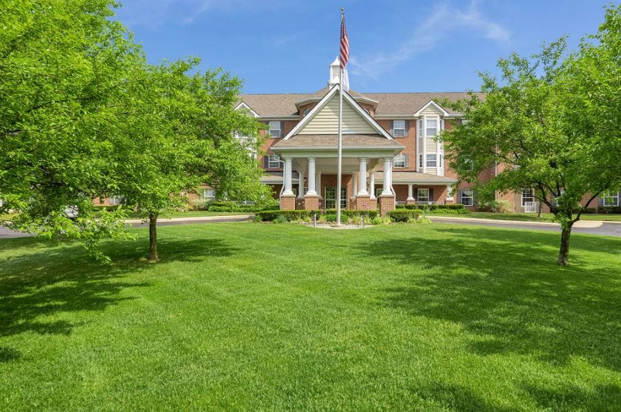 Exterior view of Elmhaven Manor with landscaped grounds