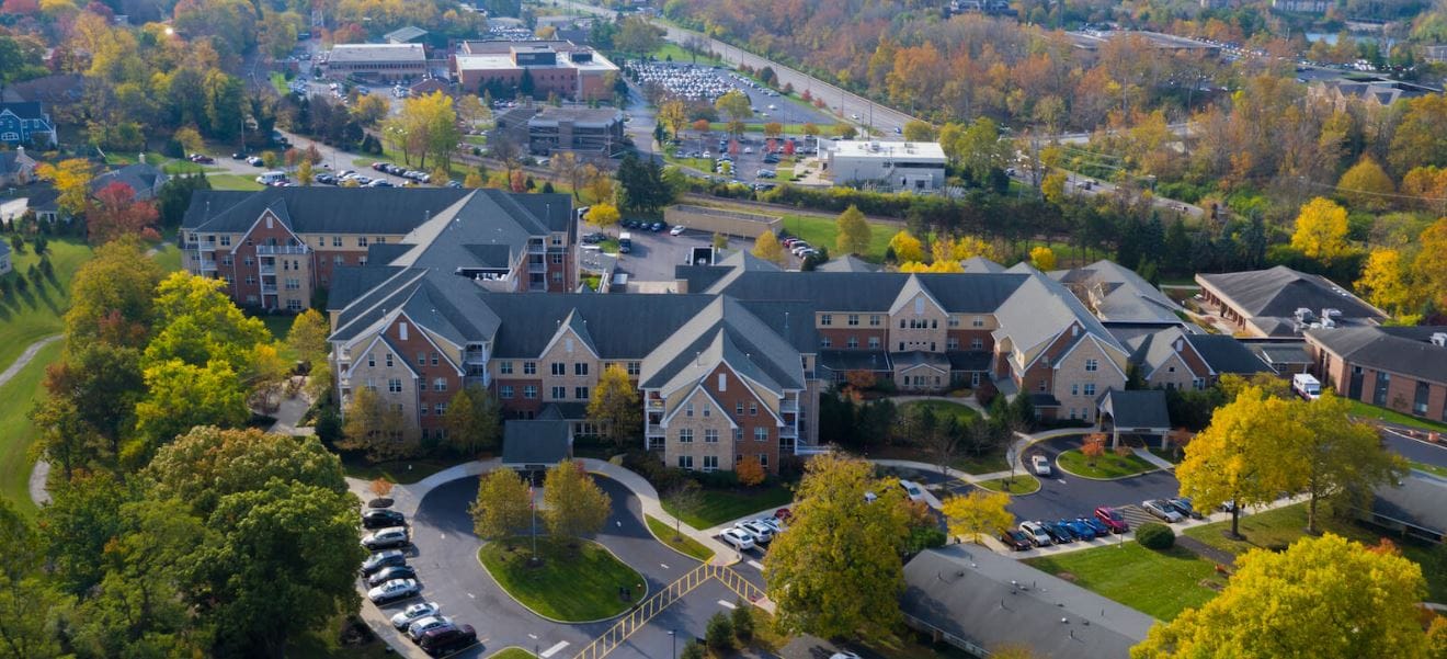 Aerial view of the community with autumn trees