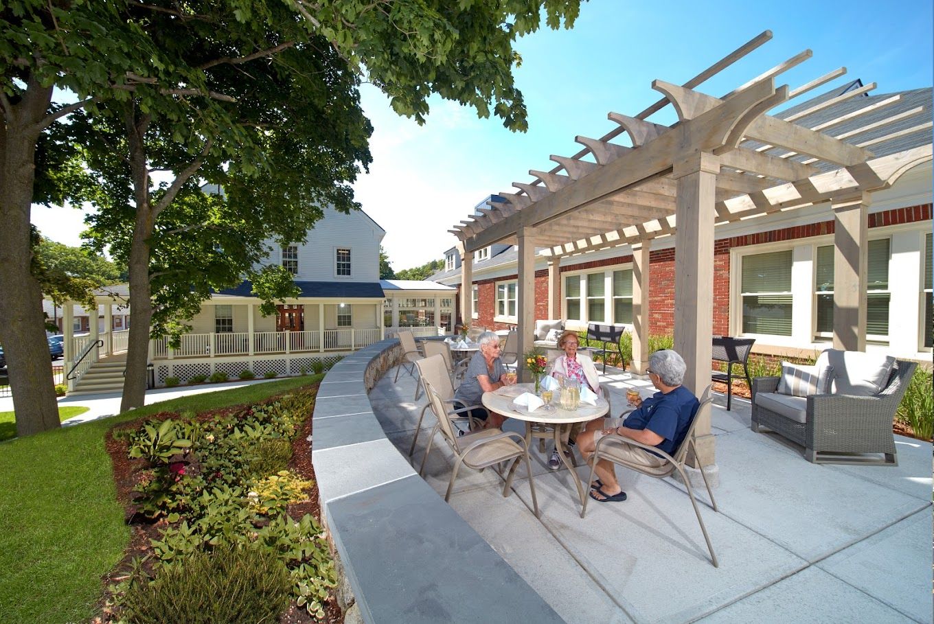 Residents enjoying outdoor seating at the facility
