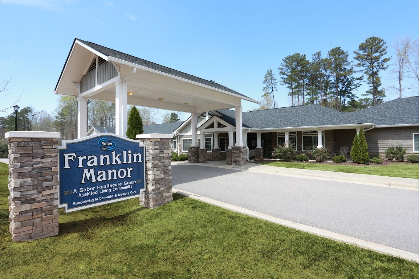 Exterior view of Franklin Manor with signage