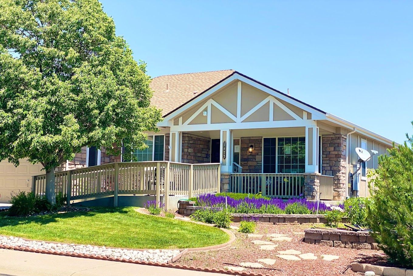 Exterior view of a senior living facility with gardens