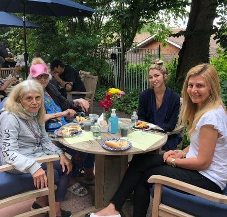 Residents enjoying food in an outdoor area