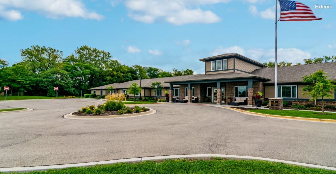 Front exterior view of Harvester Place with landscaped entrance