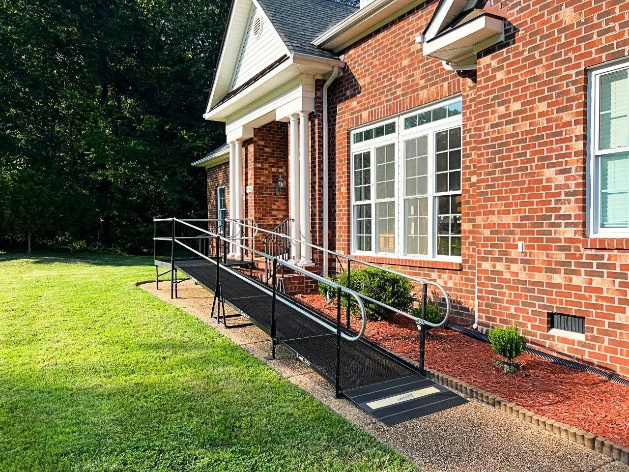 Exterior view of a facility entrance with ramp