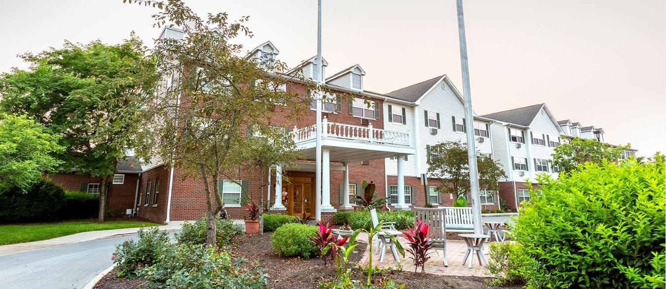 Exterior view of Independence Village with outdoor seating area