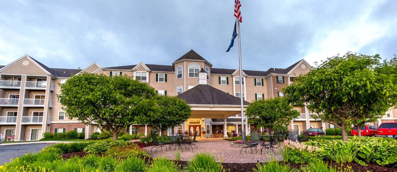 Exterior view of the Independence Village building with outdoor space