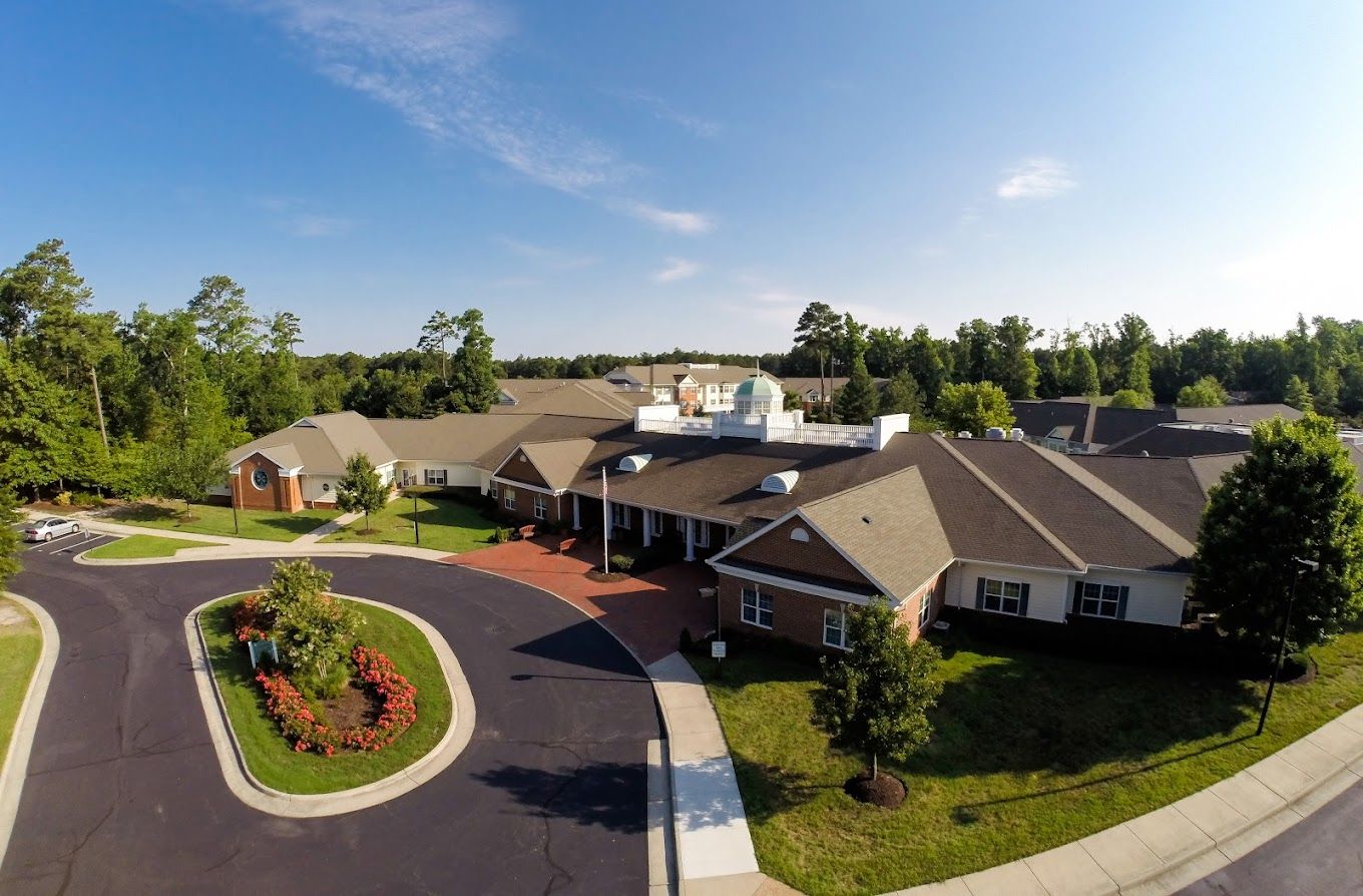 Aerial view of Lake Prince Woods facility surrounded by gardens