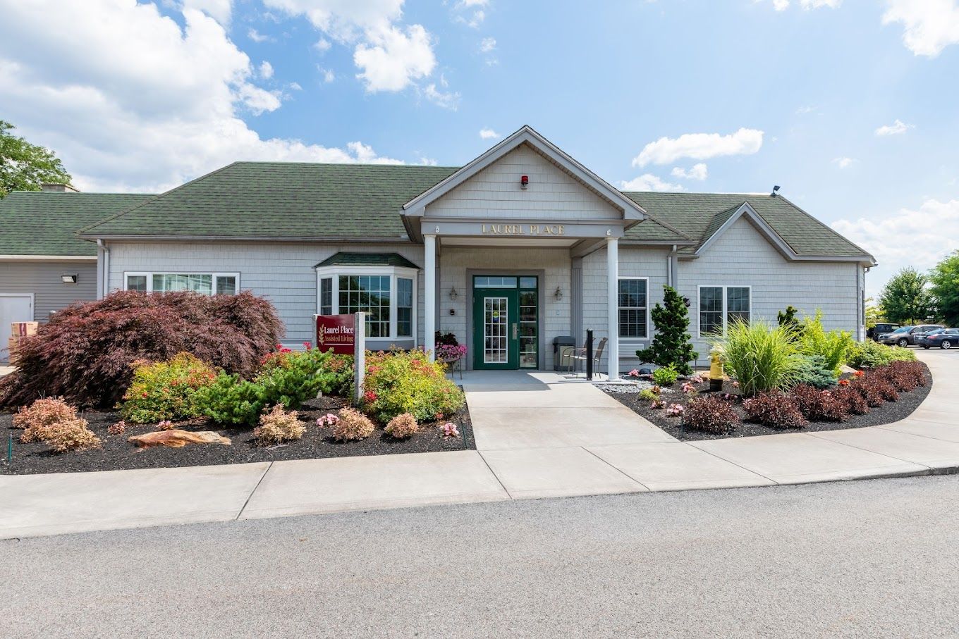 Exterior view of Laurel Place Assisted Living with landscaping