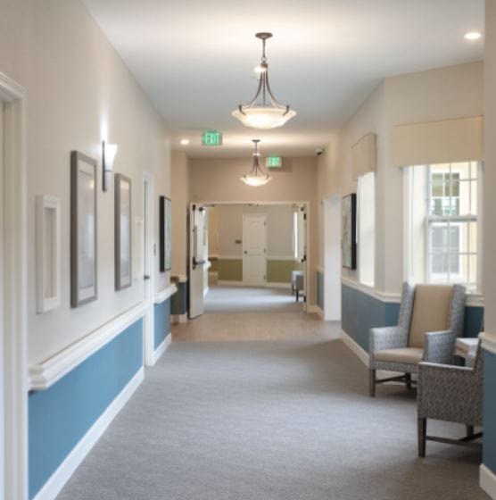 A well-lit hallway in a senior living facility