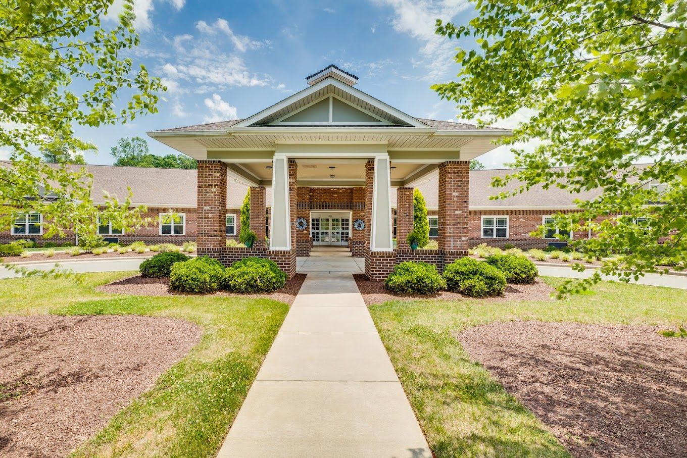 Exterior view of Mebane Ridge entrance with landscaping