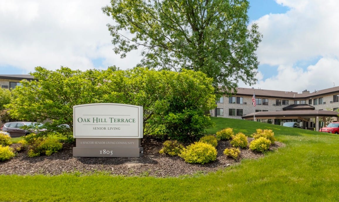 Exterior view of Oak Hill Terrace Senior Living sign and building
