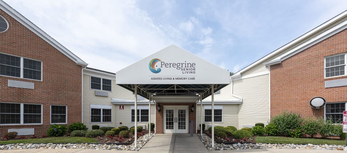 Entrance of Peregrine Senior Living facility with a canopy