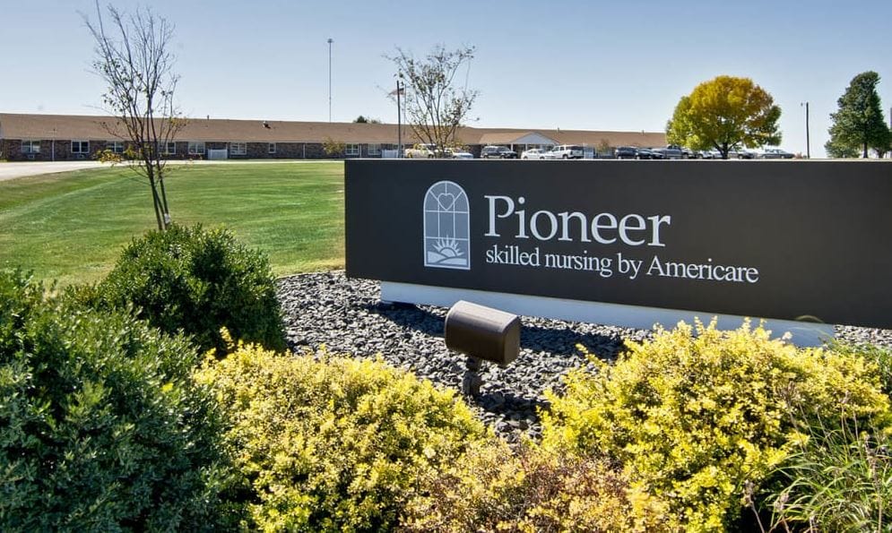 Signage for Pioneer skilled nursing facility with landscaping