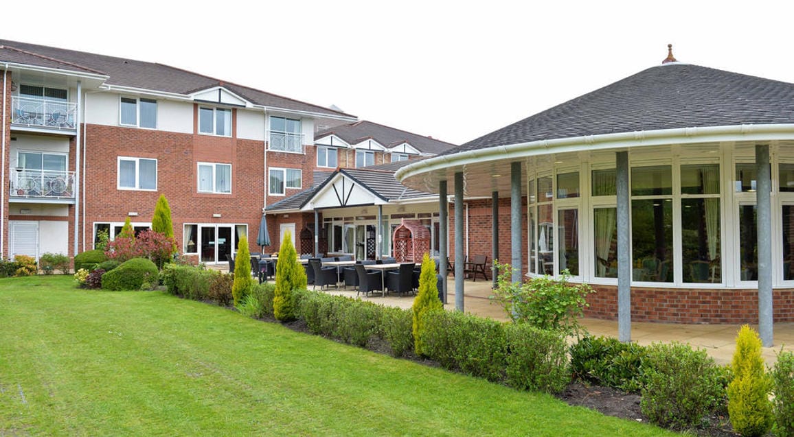 Exterior view of Reeve Court Village with gardens