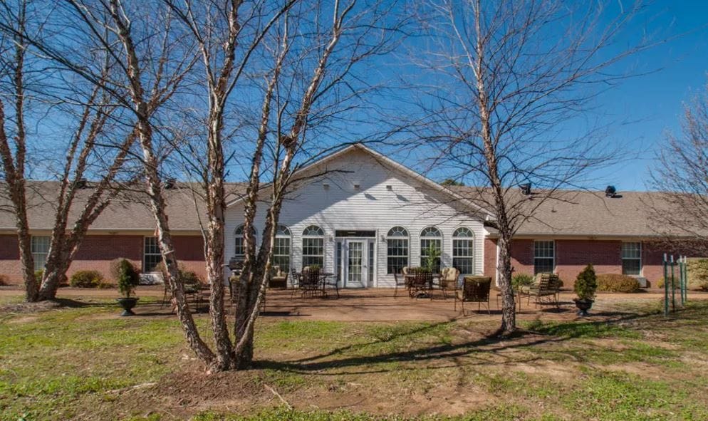 Exterior view of RiverWick nursing home with outdoor seating