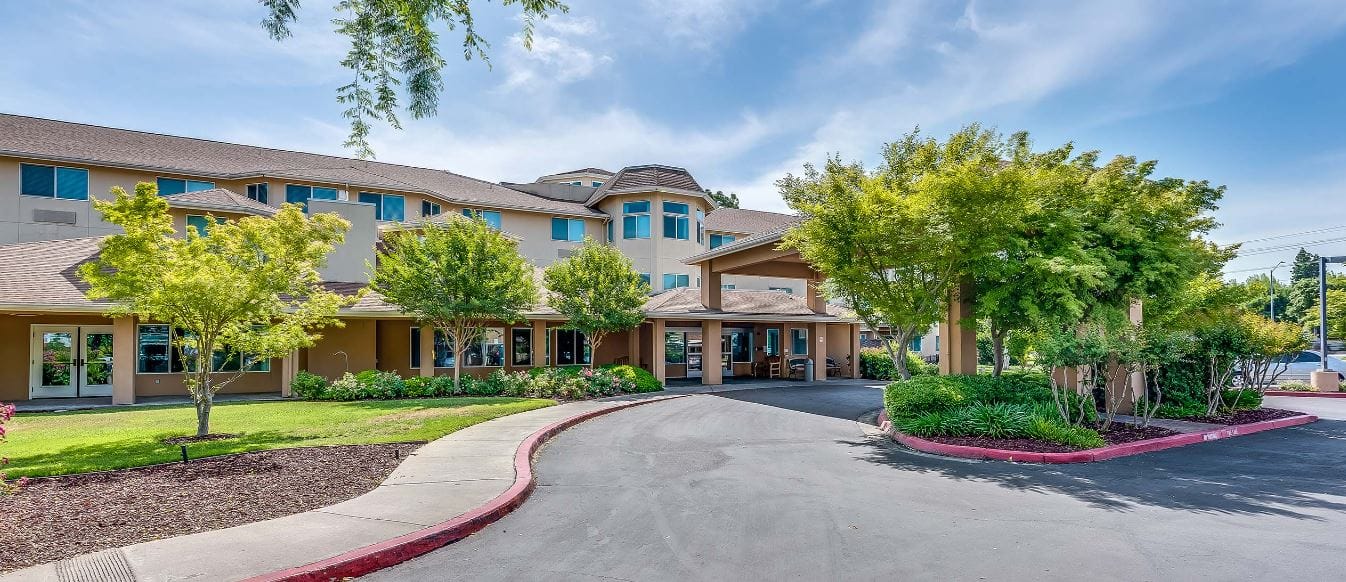 Exterior of Solstice Senior Living at Lodi surrounded by trees