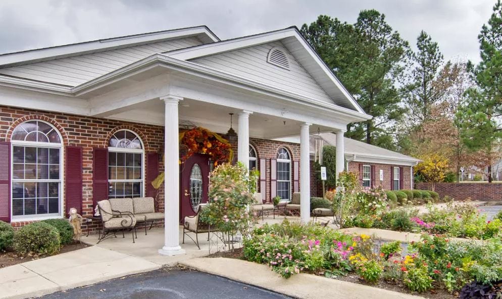 Exterior view of Southern Oaks with flower garden