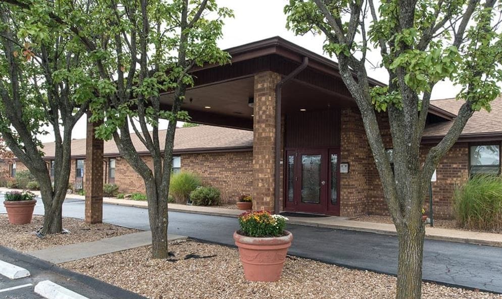 Entrance of St. Clair Nursing Center surrounded by trees