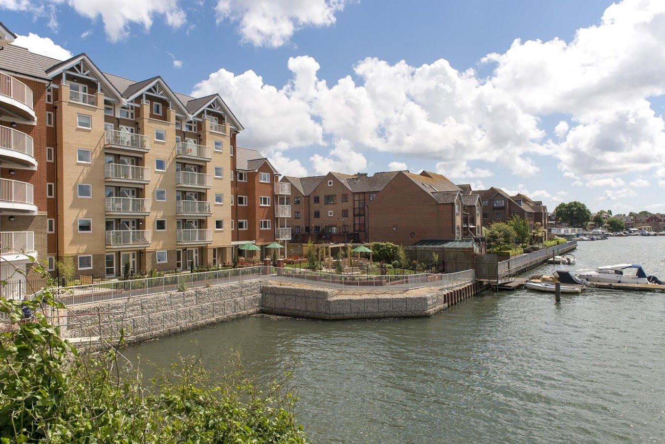 Exterior view of The Boathouse Retirement Living by the water