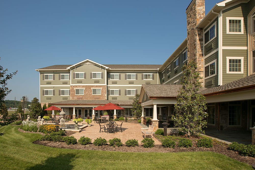 Exterior view of a senior living facility patio area