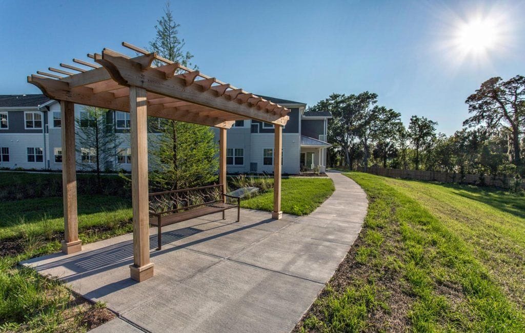Outdoor seating area with pergola and pathway