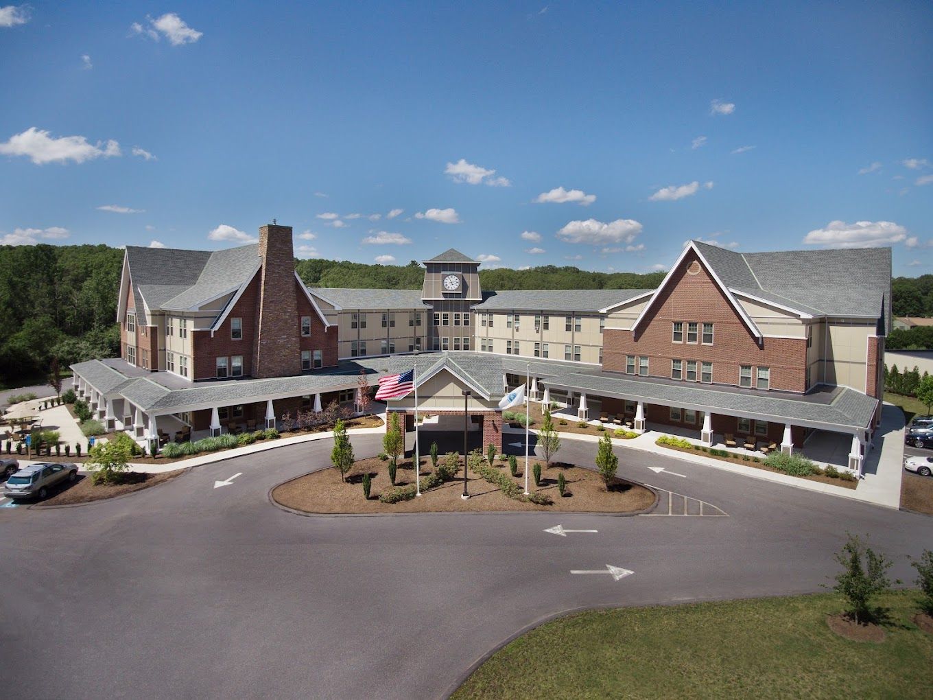 Exterior view of assisted living facility with landscaped entrance