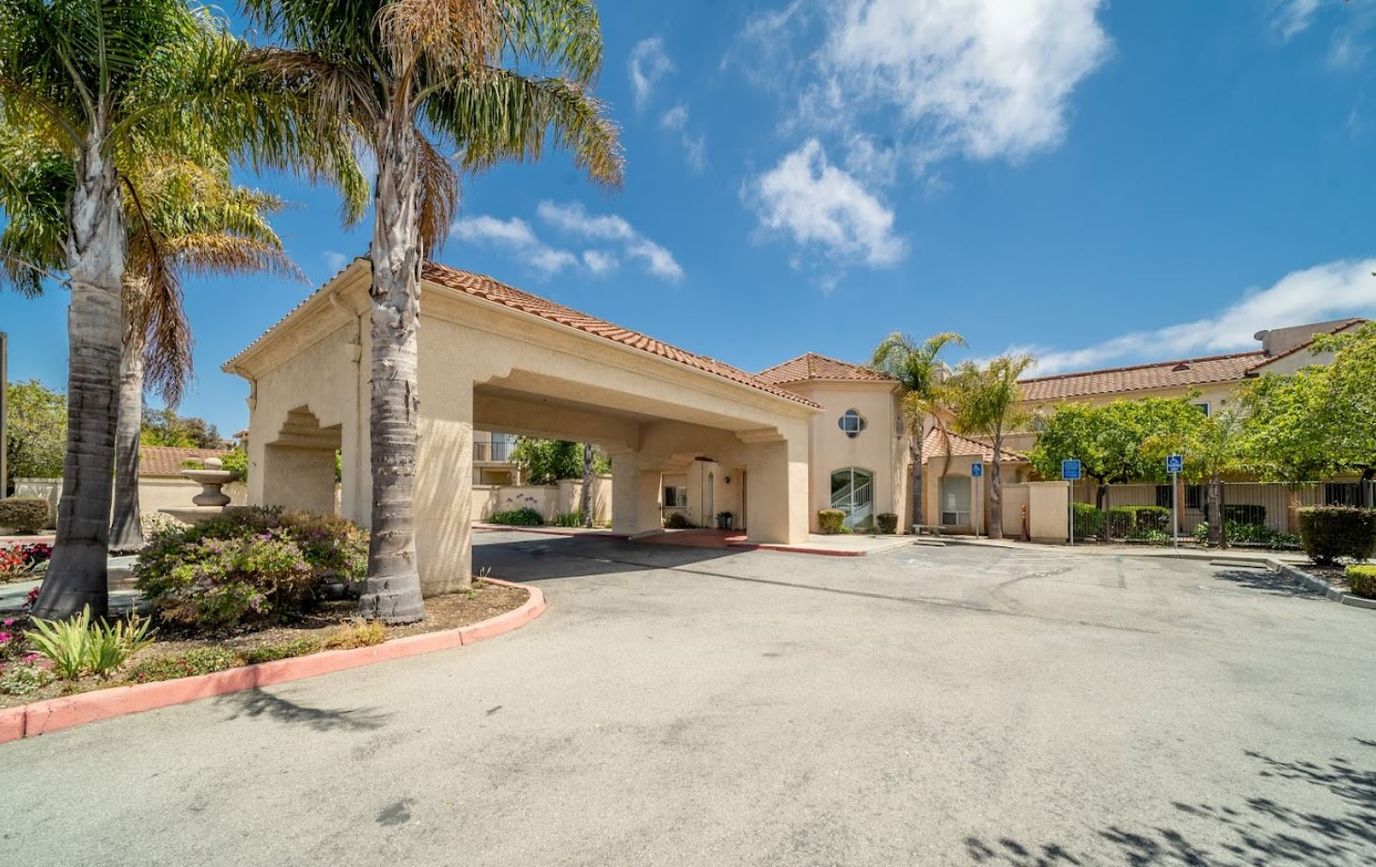 Front entrance of Vista Harden Ranch with palm trees