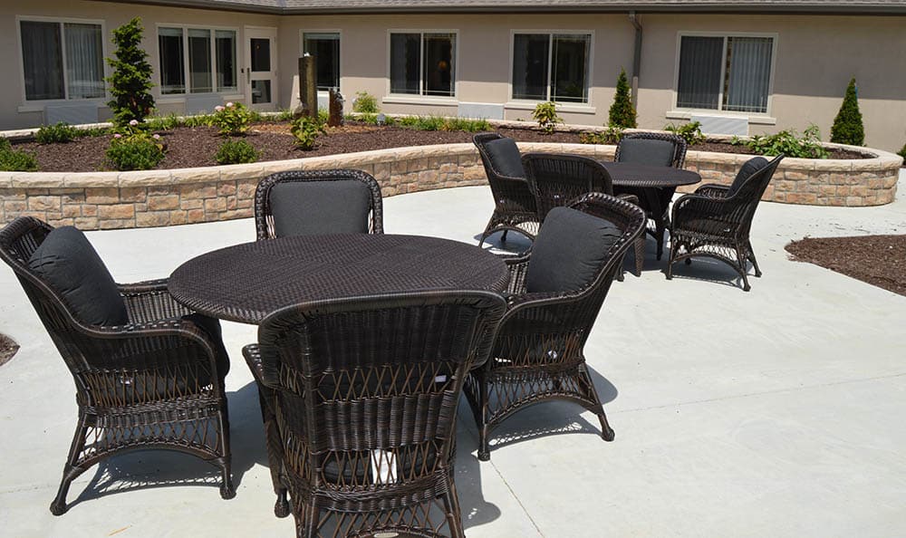 Outdoor seating area with tables and chairs