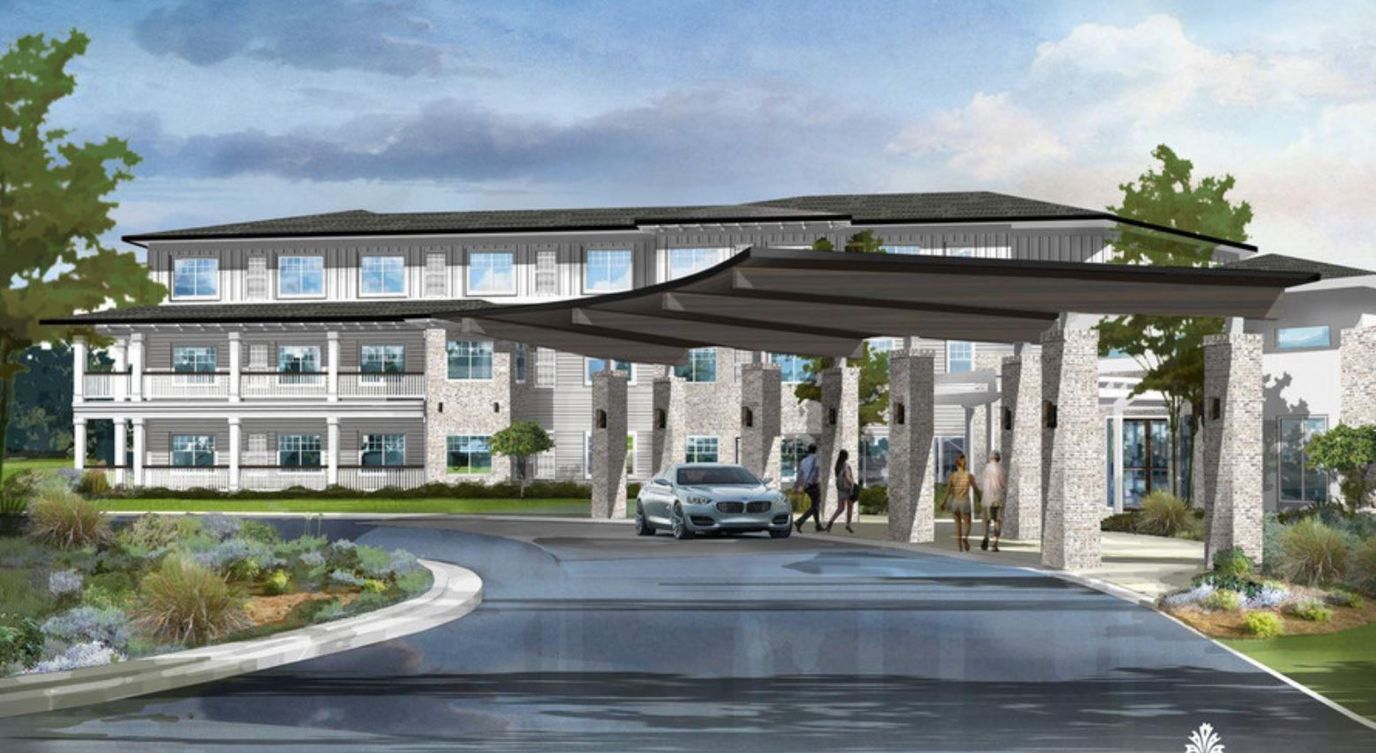 Entrance of Watercrest Macon with outdoor space and vehicles