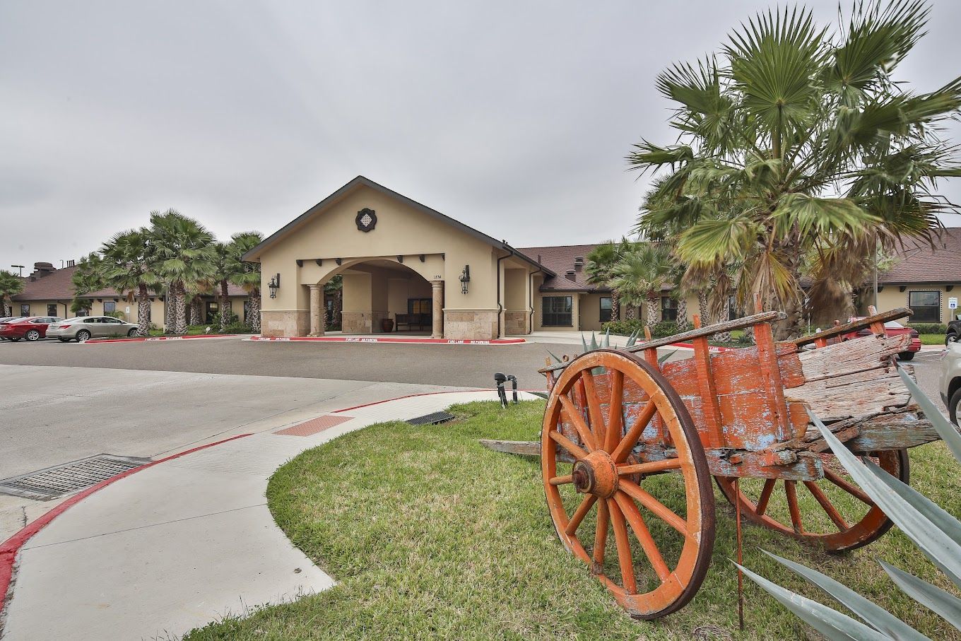 Exterior view of a senior living facility with landscaping
