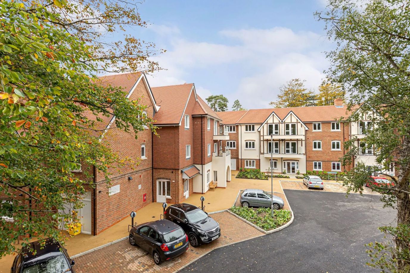 Exterior view of Woodbank Apartments with landscaped area