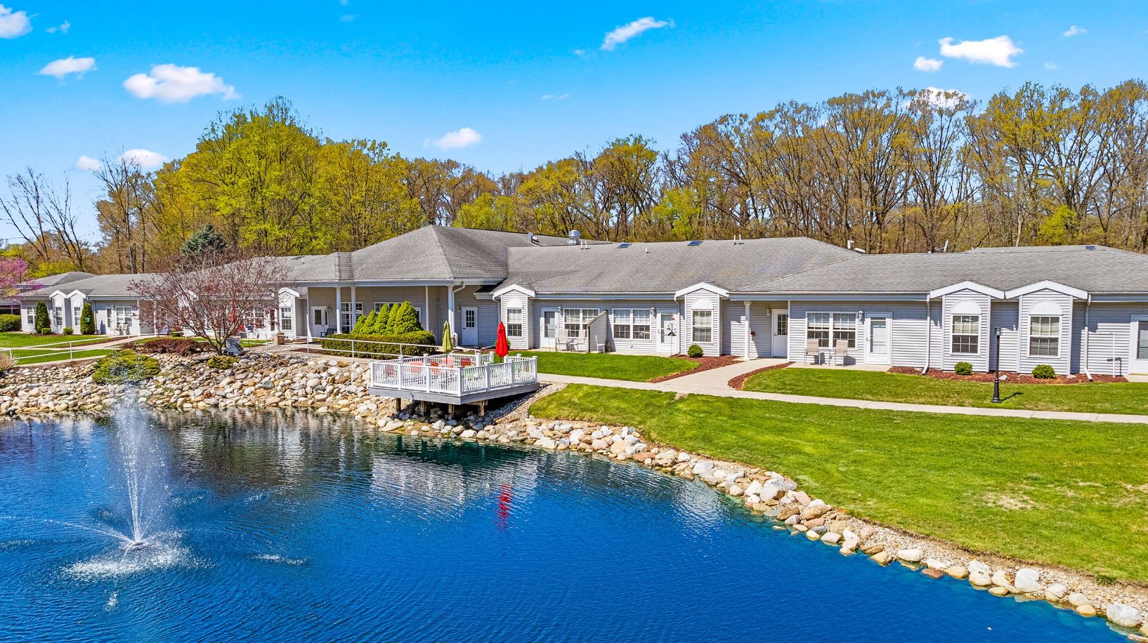 Aerial view of Woodland Terrace with pond and garden
