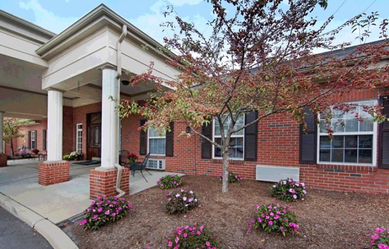Exterior view of Downriver Estates Senior Living with landscaping