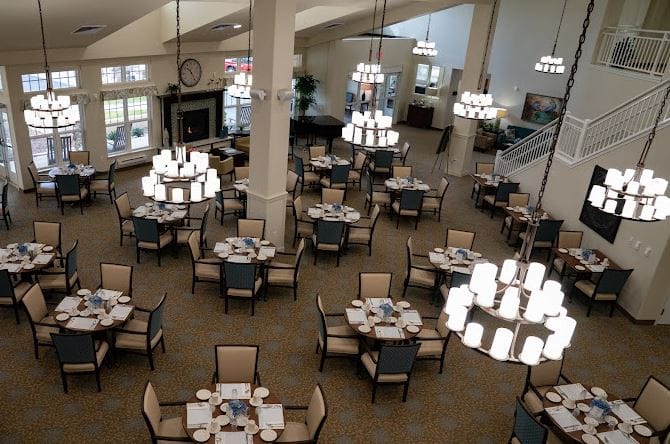 Dining room with tables set for residents