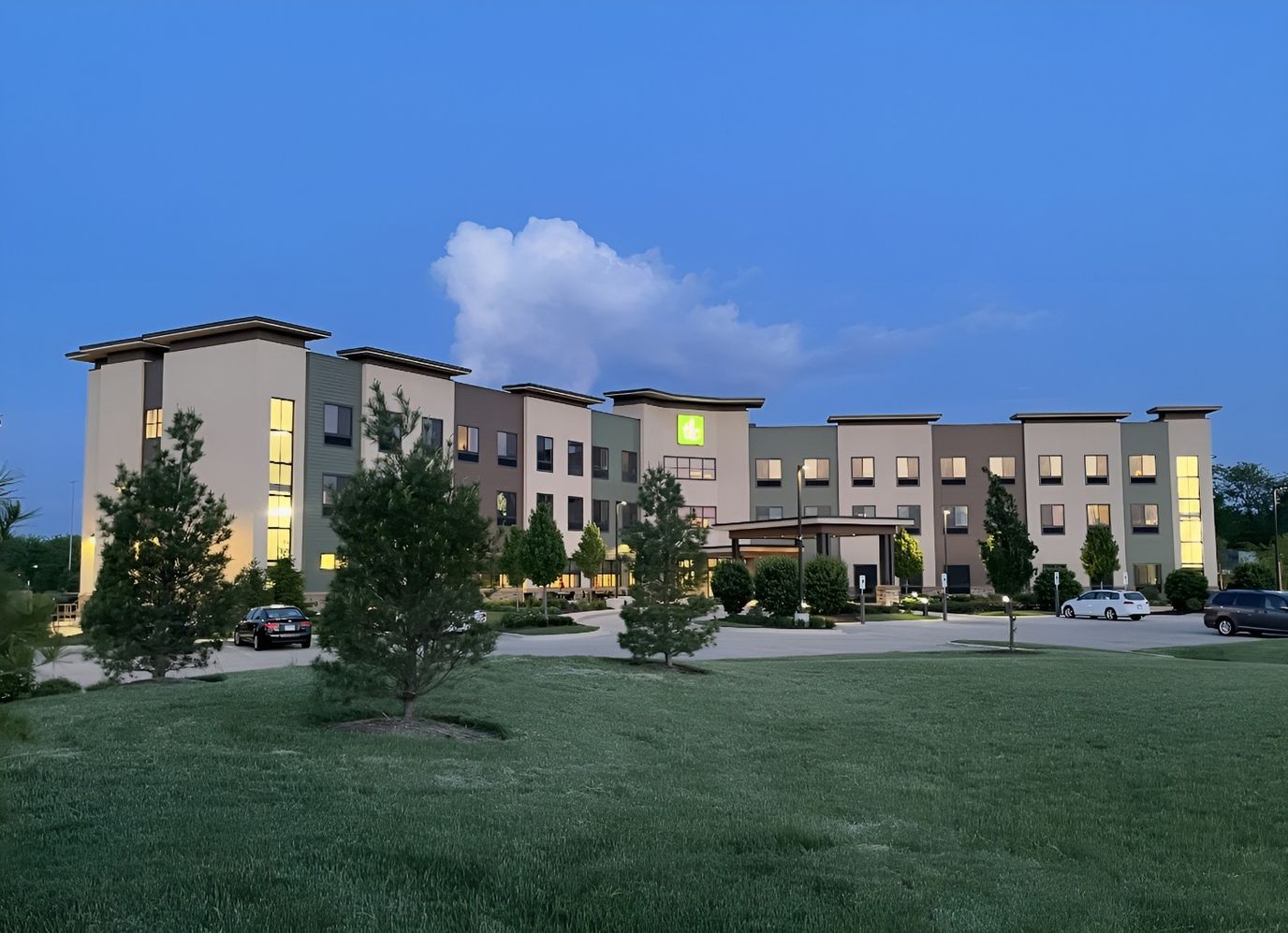 Exterior view of the TLC Assisted Living facility at dusk