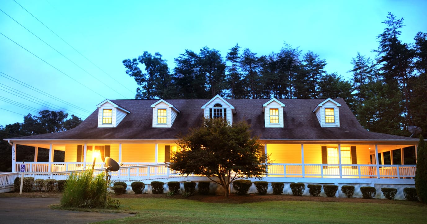 Exterior view of a assisted living facility at dusk