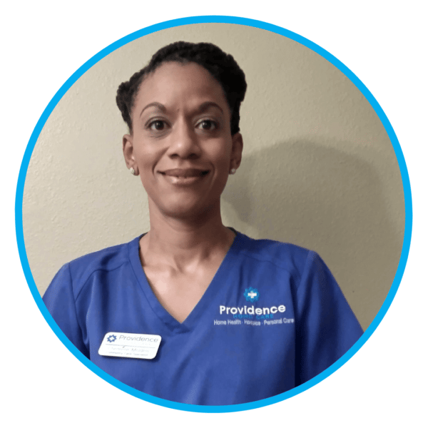 Staff member at Providence Home Care in scrubs