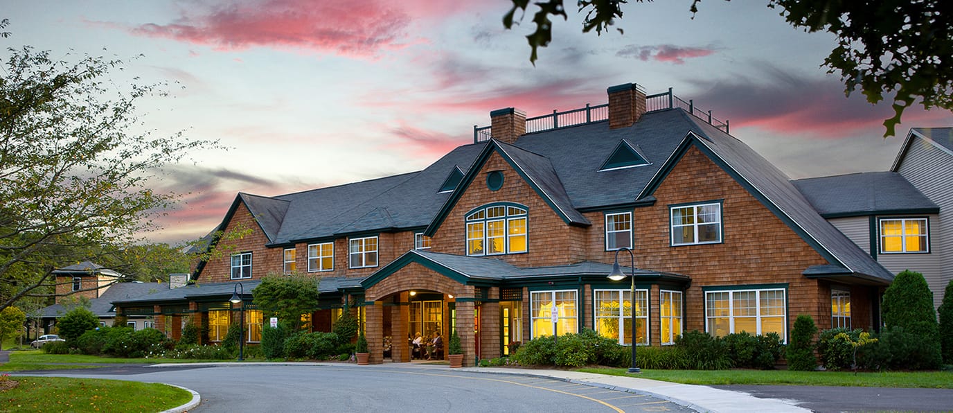 Exterior view of Autumn Glen at Dartmouth at sunset