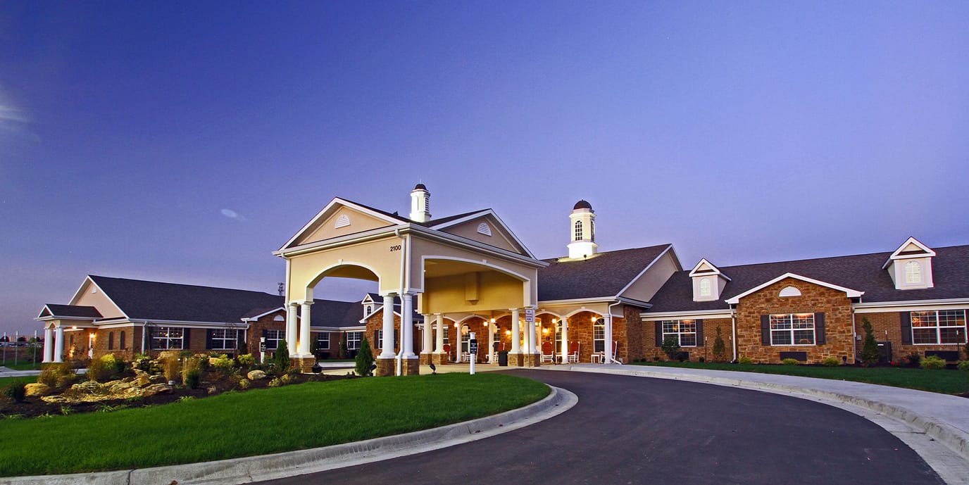 Exterior view of Benton House of Raymore at dusk