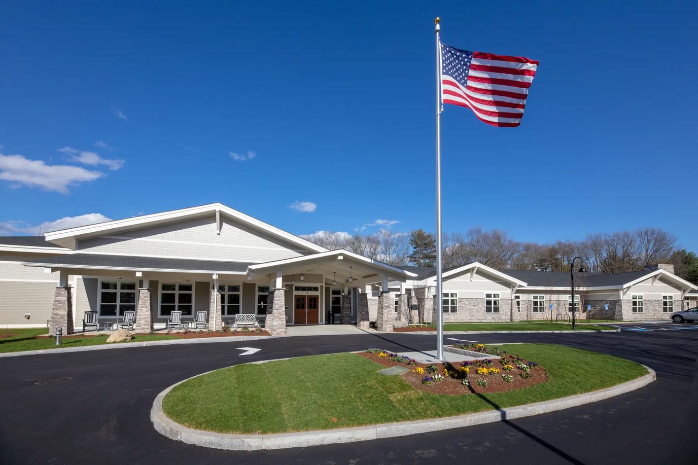 Exterior view of assisted living facility with American flag
