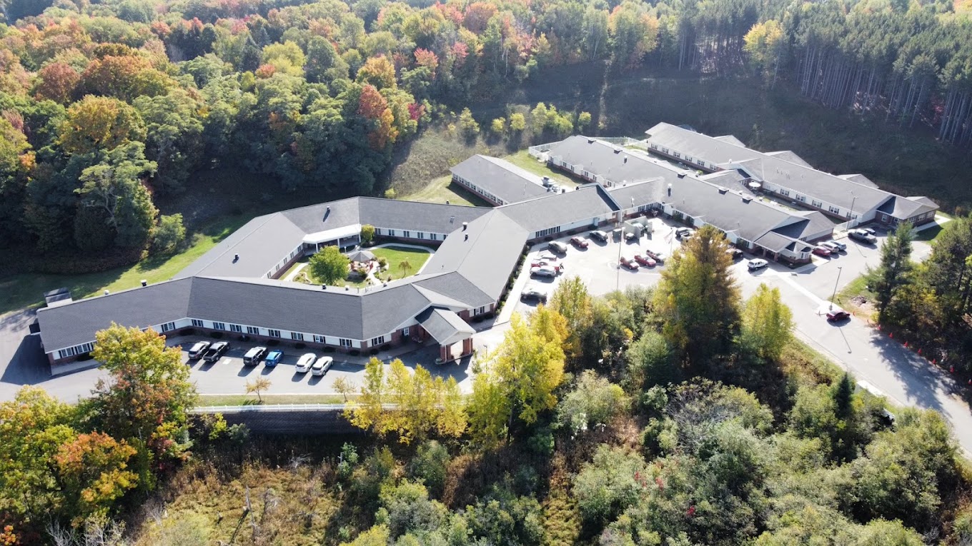 Aerial view of Brookridge Heights facility surrounded by trees